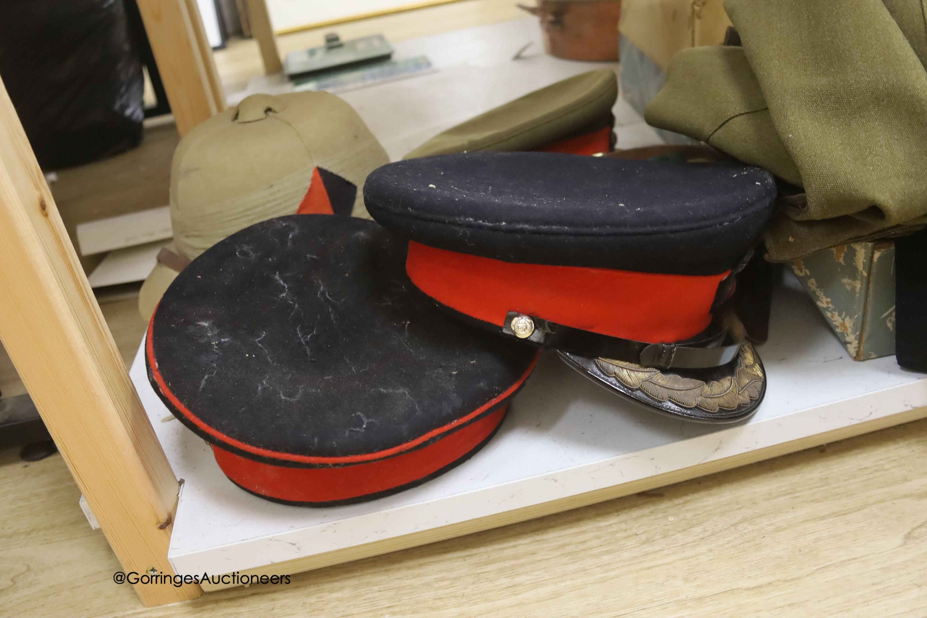 An R.A. cap, dress jacket, pith helmet and SRN uniform